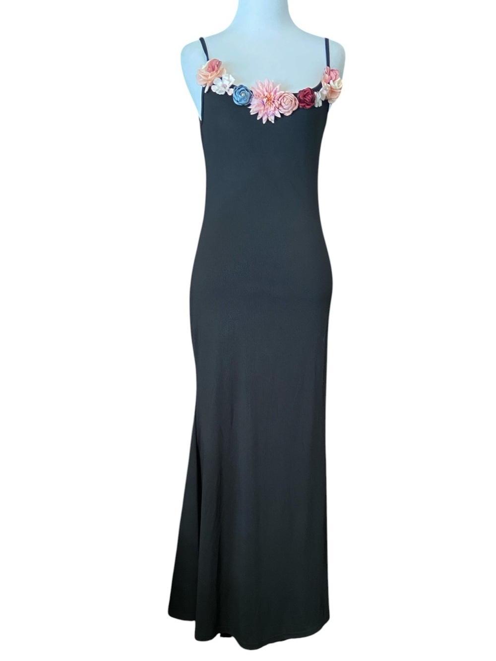 Black maxi dress with flowers at neckline. New. Spaghetti straps. Mermaid hem.